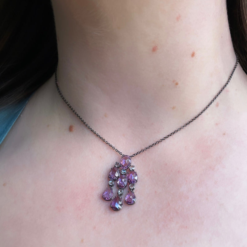 Bayco Jewels 18 karat blackened gold pendant with 7 natural, unheated  briolette cut purple sapphires, separated with round rose-cut diamond spacers on blackened gold chain, pictured on model