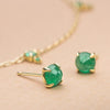 ILA 14KY Clarence Emerald Stud Earrings with gold necklace in background