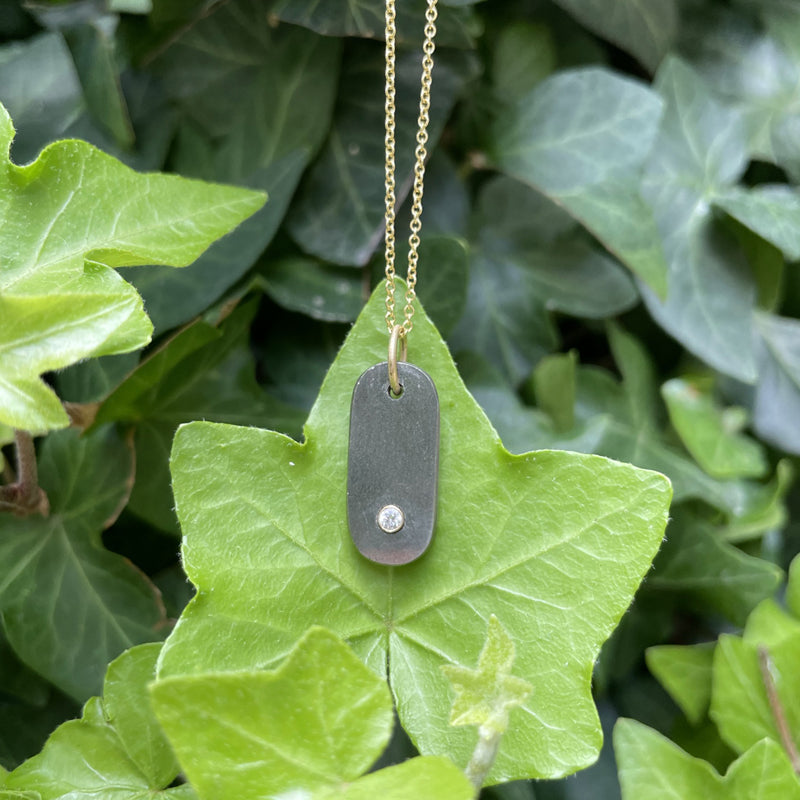 Pyrite Gem Tab Charm, green background