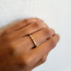 Brushed 18K yellow gold eternity band with flush set multi color diamonds, on hand