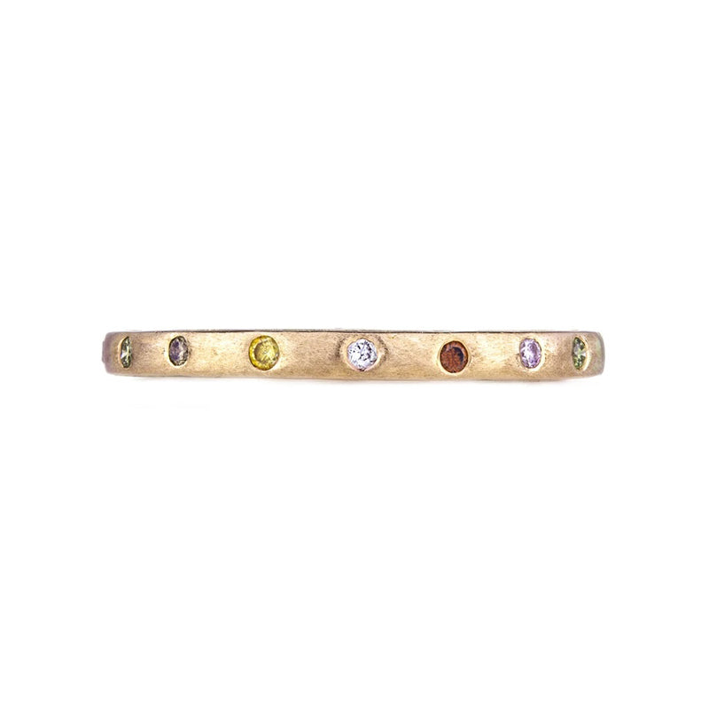 Brushed 18K yellow gold eternity band with flush set multi color diamonds