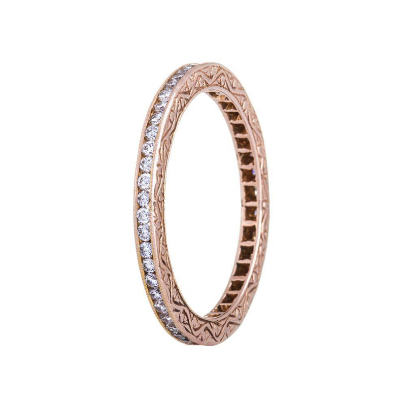 18K rose gold channel set diamond eternity band with hand engraving on the sides