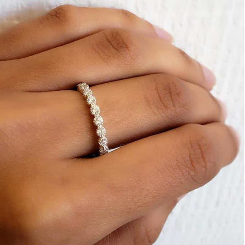 18K rose gold bezel set diamond eternity band, on hand