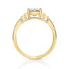 Caroline ring featuring a 1.54ct I/VVS2 GIA certified emerald cut diamond with 0.40ctw baguette cut accent diamonds set in an 18K yellow gold mounting, side view.