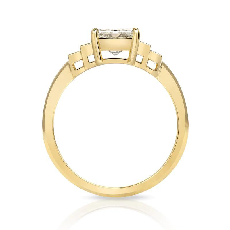 Caroline ring featuring a 1.54ct I/VVS2 GIA certified emerald cut diamond with 0.40ctw baguette cut accent diamonds set in an 18K yellow gold mounting, side view.