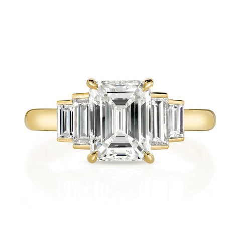 Caroline ring featuring a 1.54ct I/VVS2 GIA certified emerald cut diamond with 0.40ctw baguette cut accent diamonds set in an 18K yellow gold mounting, front view.