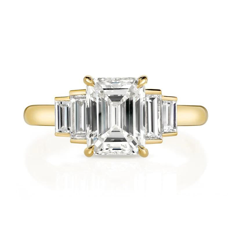Caroline ring featuring a 1.54ct I/VVS2 GIA certified emerald cut diamond with 0.40ctw baguette cut accent diamonds set in an 18K yellow gold mounting, front view.
