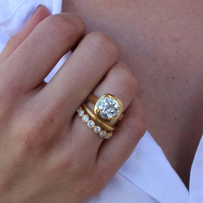 Single Stone 18K Yellow Gold "Gabby" Diamond Eternity Band on hand