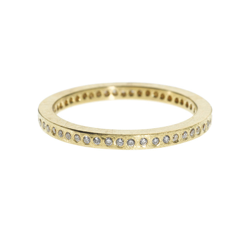 Todd Reed rough-textured yellow gold ring set with tiny diamonds
