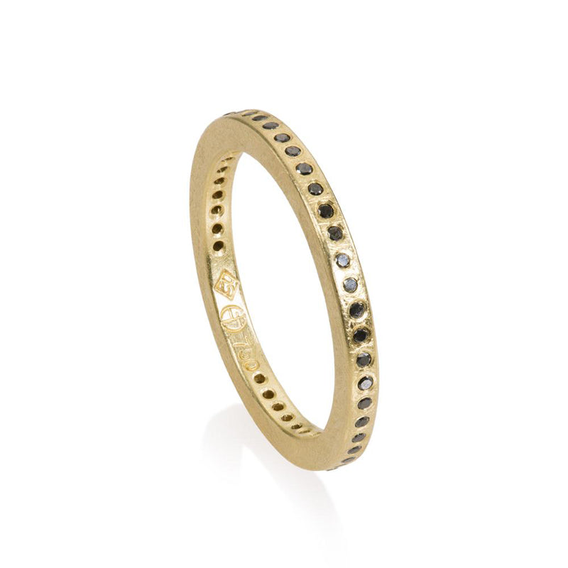 18K yellow gold flush set black diamond eternity band, part of the Todd Reed jewelry collection
