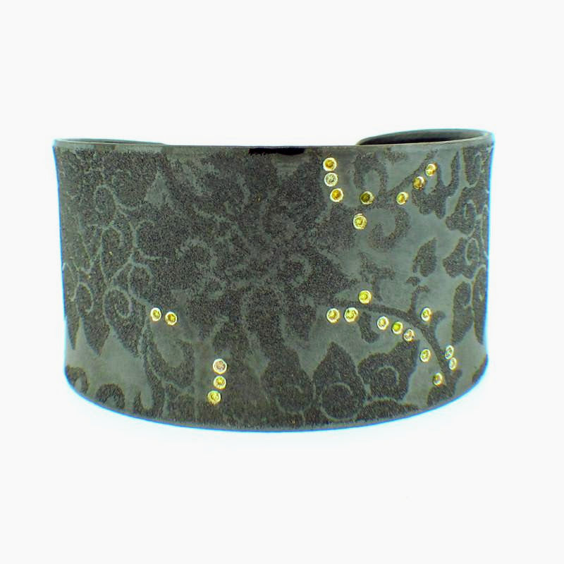 Atelier Zobel large green cuff with paisley design and tiny orange diamonds