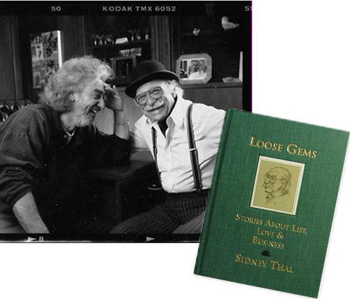 Chai and Sid sitting in the office they shared and Loose Gems green book written by Sid Thal.