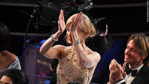 Photo of Nicole Kidman awkwardly clapping at an awards show.