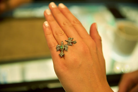 Arman double bird ring on hand