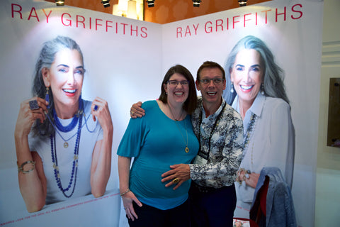Photo of Zoey and Ray at his booth Ray Griffiths. 