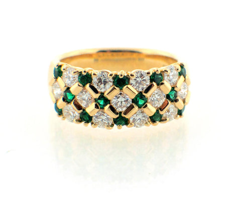 Emerald and diamond honeycomb looking yellow gold ring.