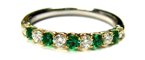 Emerald and diamond ring with 11 stones total. 