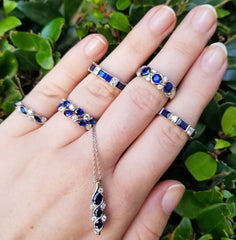 SUWA Sapphire rings on a hand