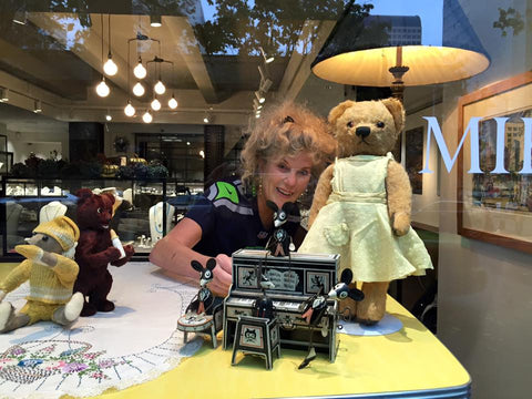 Photo of Joy Mann doing the windows at the new Fox's Seattle