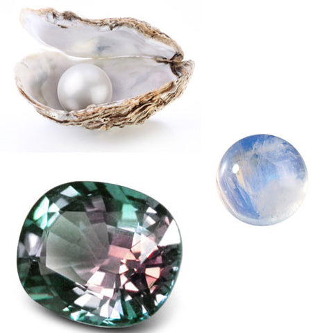Pearl in oyster shell, moonstone and Alexandrite gemstones.