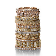 large Sethi Couture stack of wedding bands in 18k yellow, rose, and white gold in different shapes