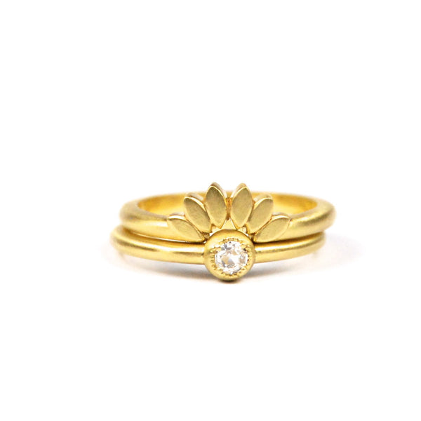 18K yellow gold Petal tracer band show in stack with 18K yellow gold round diamond solitaire
